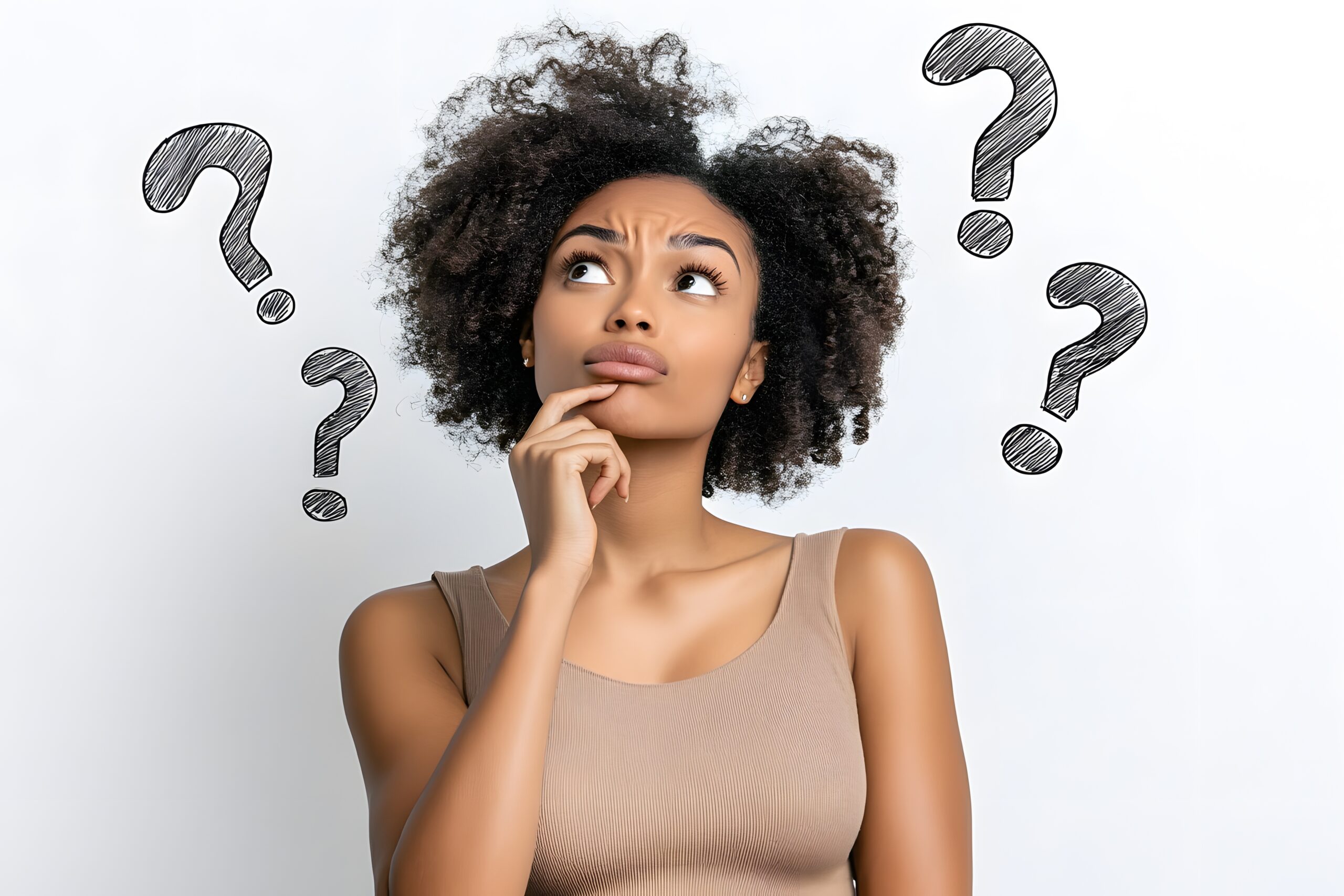 young woman thinking with her hand on chin and with question marks around, white background